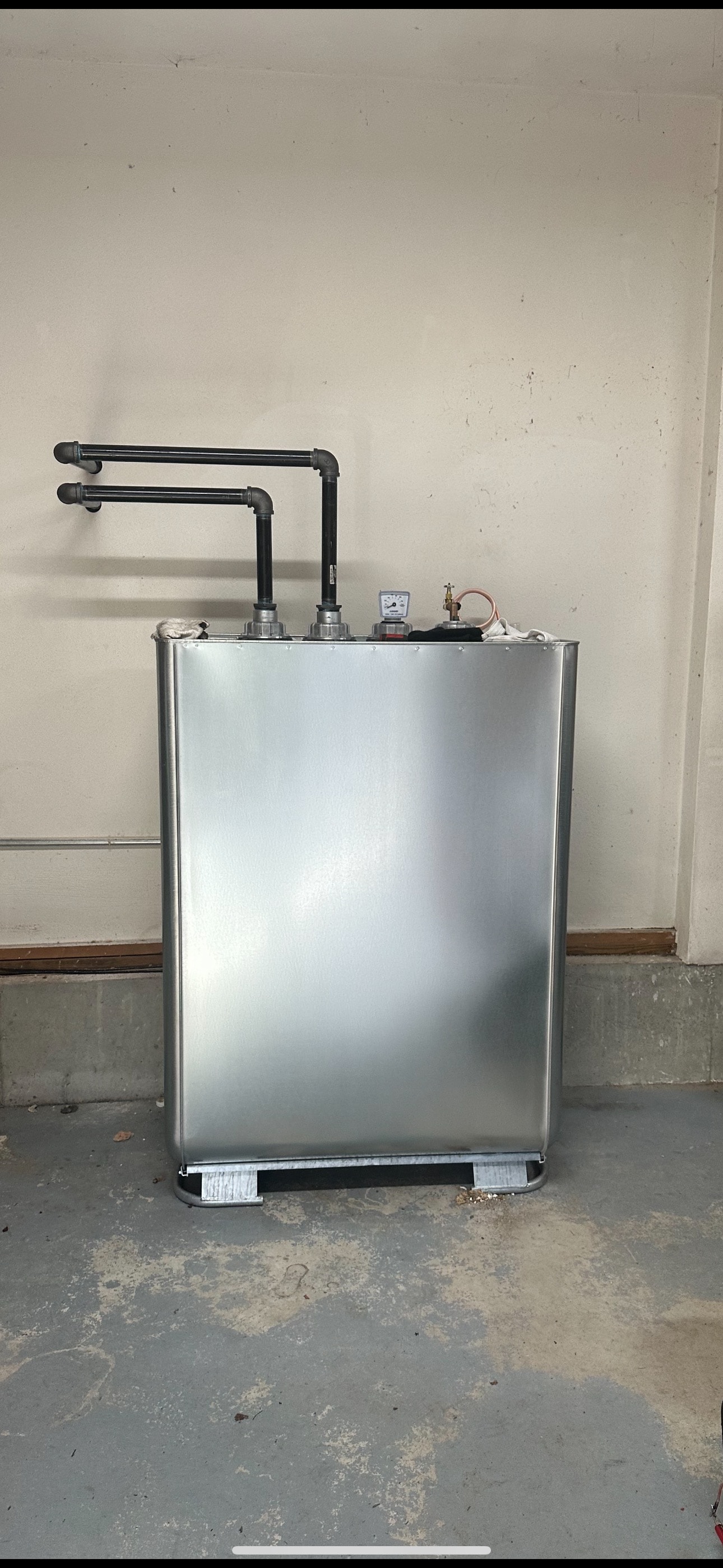 Home heating oil tank with piping